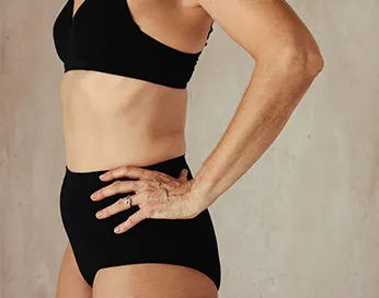 Middle aged woman body with black underwear