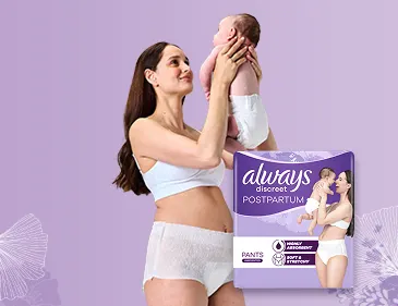 Happy mother holding her baby up in the air 
