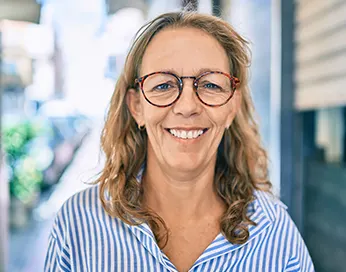 Smiling middle-aged woman with glasses