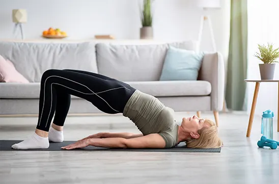 Woman doing pelvic floor exercises: Bridges