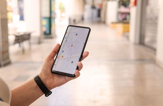 Person with Google Maps on Smartphone