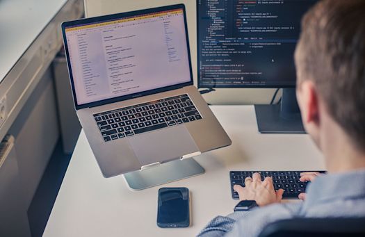 Person works with data on screens