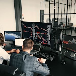 Team working on screens  in company