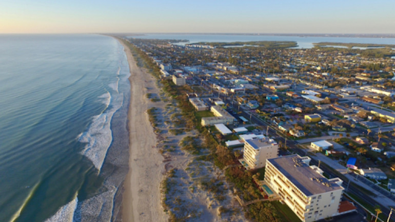 Aerial view of the Space Coast featuring downtown Cocoa Beach, FL