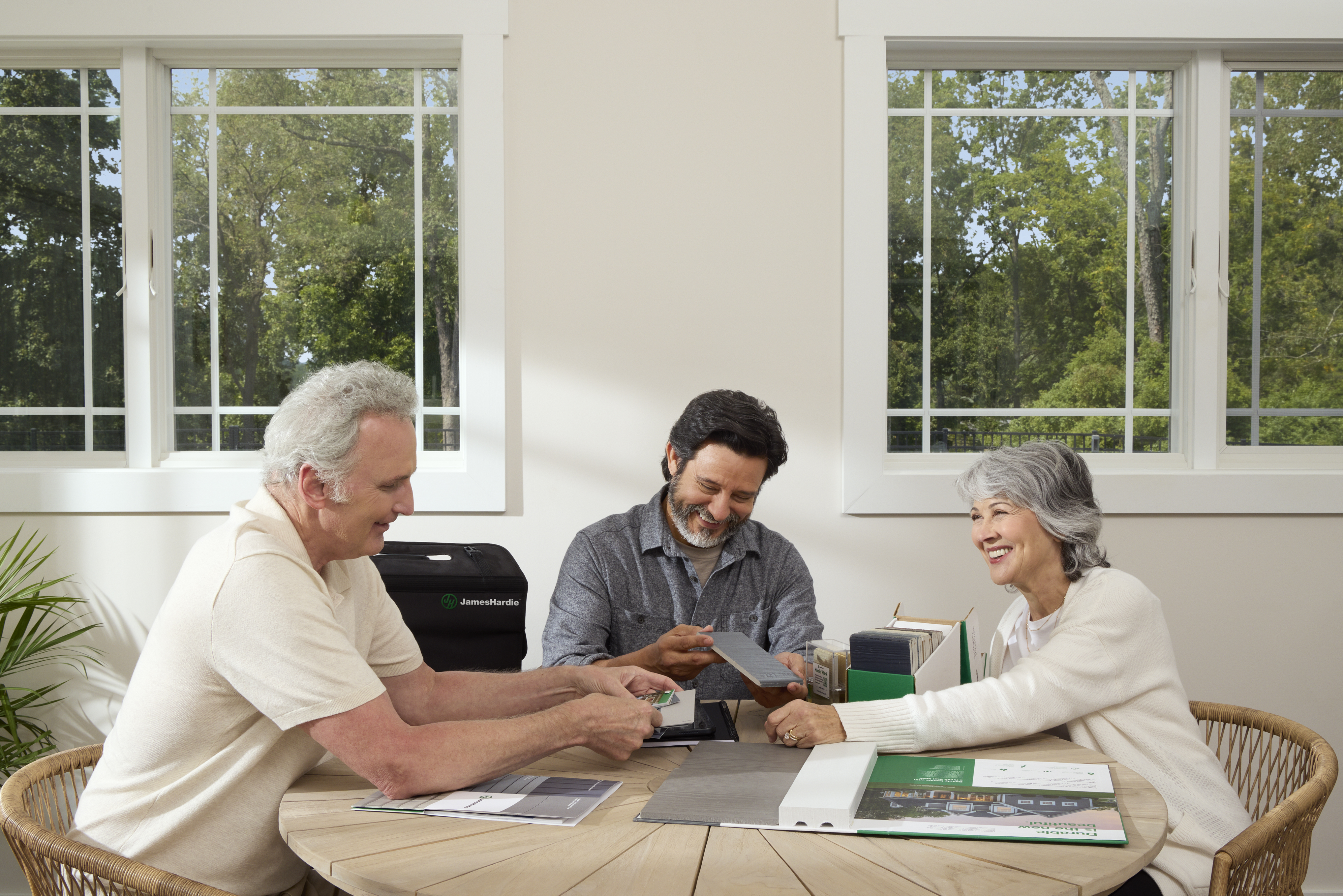 contractor meeting with family at kitchen table