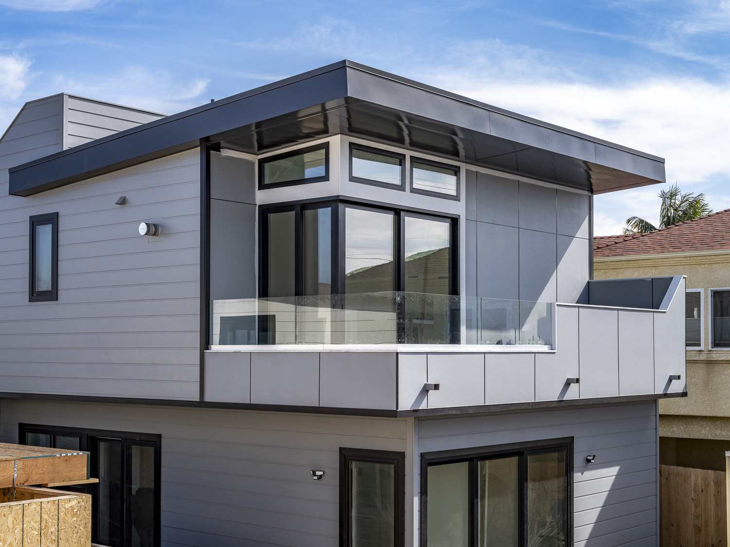 Modular beach house clad in Fine Sand textured Hardie Architectural panel 