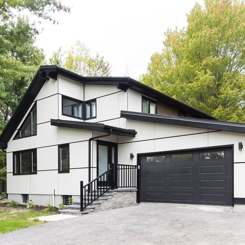 Modern two-story home clad in Arctic White Hardie® Panel 