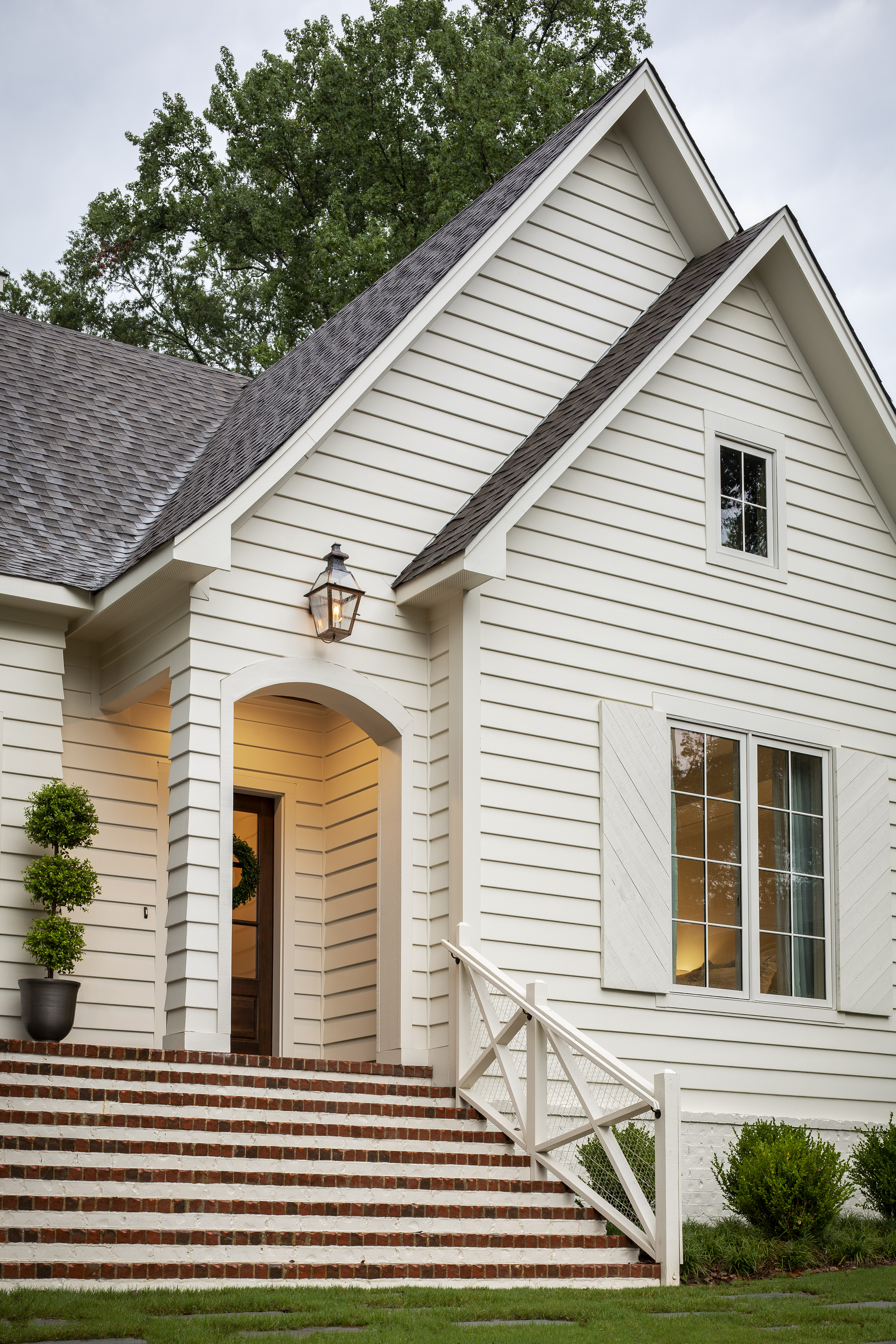 A mixed Tudor and Craftsman inspired home clad in a custom Hardie Plank Lap siding