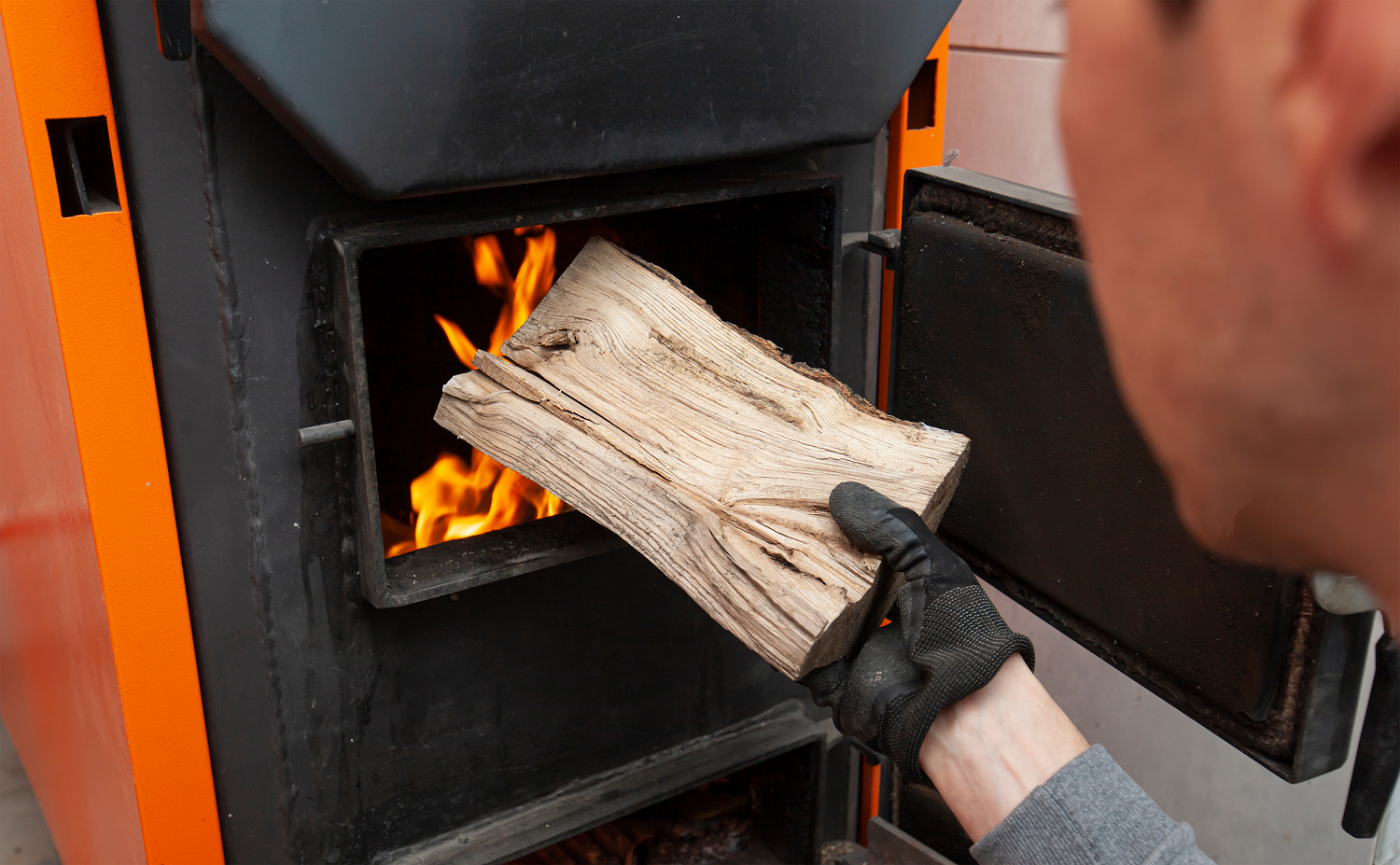 loading-wood-in-a-wood-burning-furnace