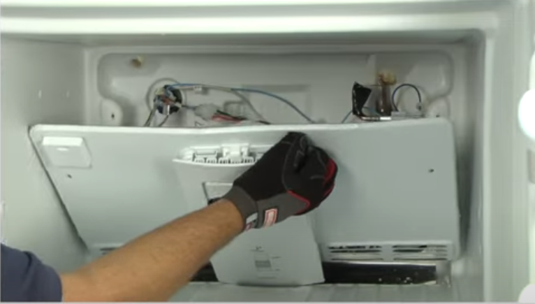 removing-the-evaporator-cover-to-clear-the-defrost-drain-tube