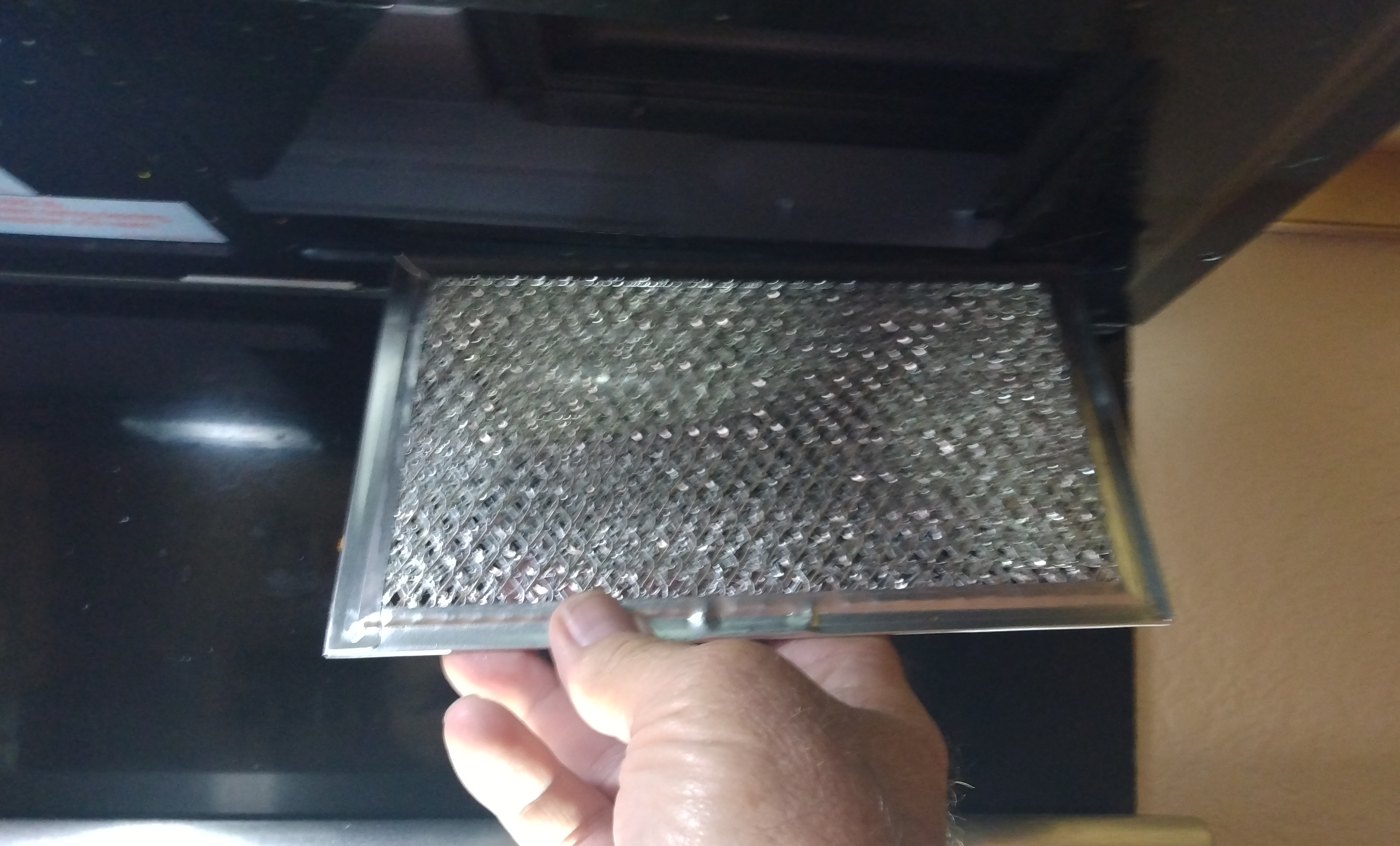 removing-range-hood-grease-filters-for-cleaning