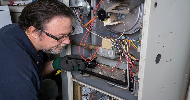 Image of cleaning the fire box in a furnace