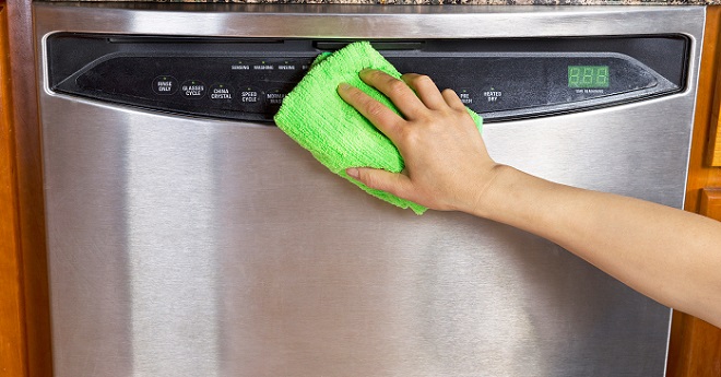 Image of cleaning the outer door panel of a dishwasher image