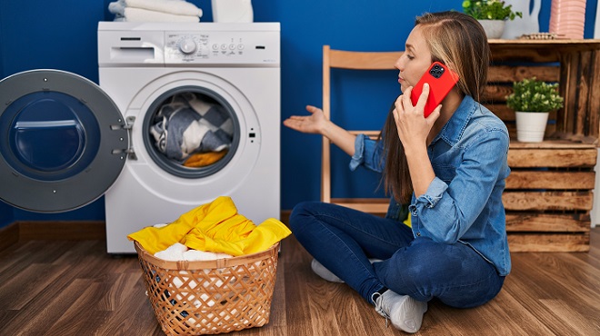 Image of a homeowner addressing an appliance repair need