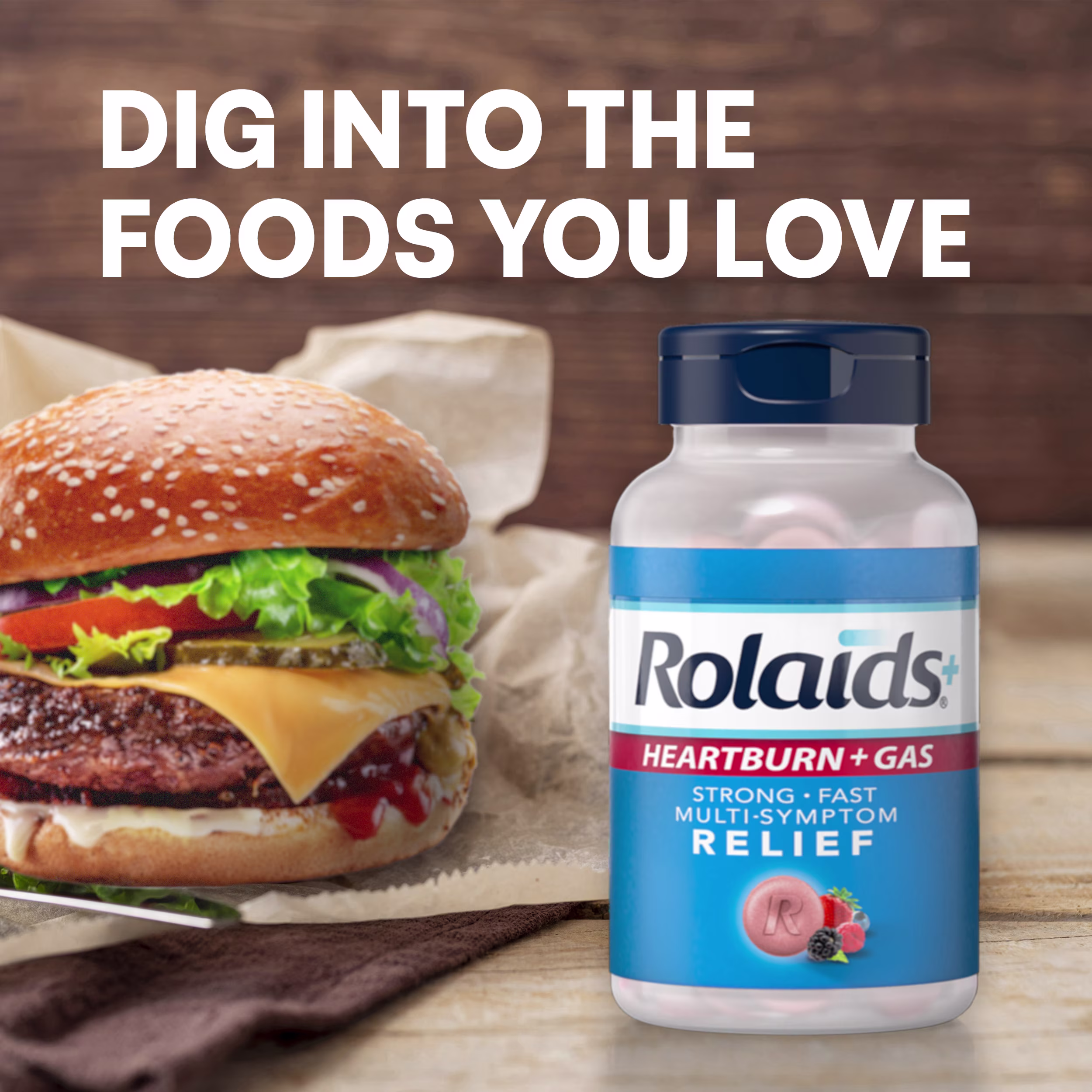 A large cheeseburger sitting next to a bottle of Rolaids Heartburn + Gas under the headline "DIG INTO THE FOODS YOU LOVE."