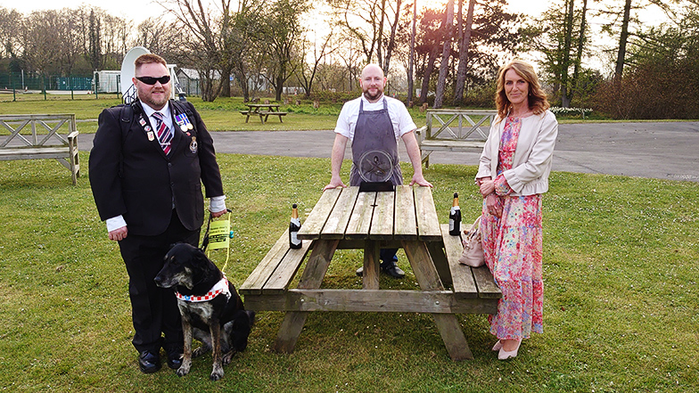 Colin with guide dog Diamond, Dan and Sally with Dan's trophy