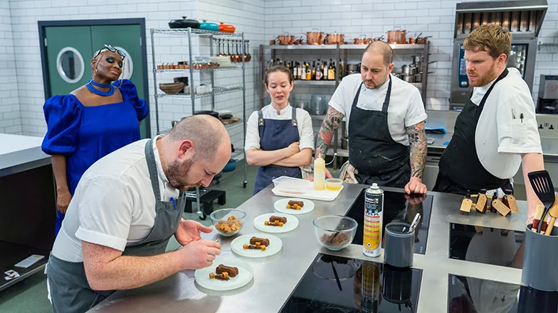 Dan McGeorge plating up his dessert dish, called 'Give A Dog A Bone'.