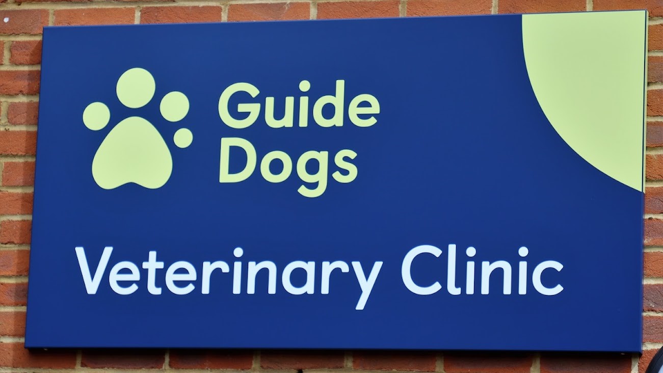 A close-up of the Guide Dogs Veterinary Clinic sign outside the Reading Hub