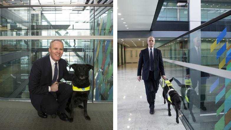 Citi employee Patrick Moran cuddling and walking with his guide dog Yoda