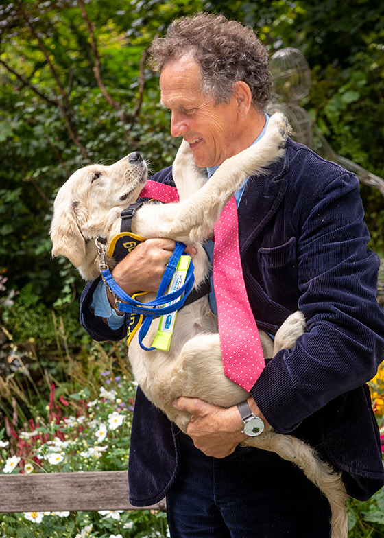 Monty Don hugging puppy Chelsea