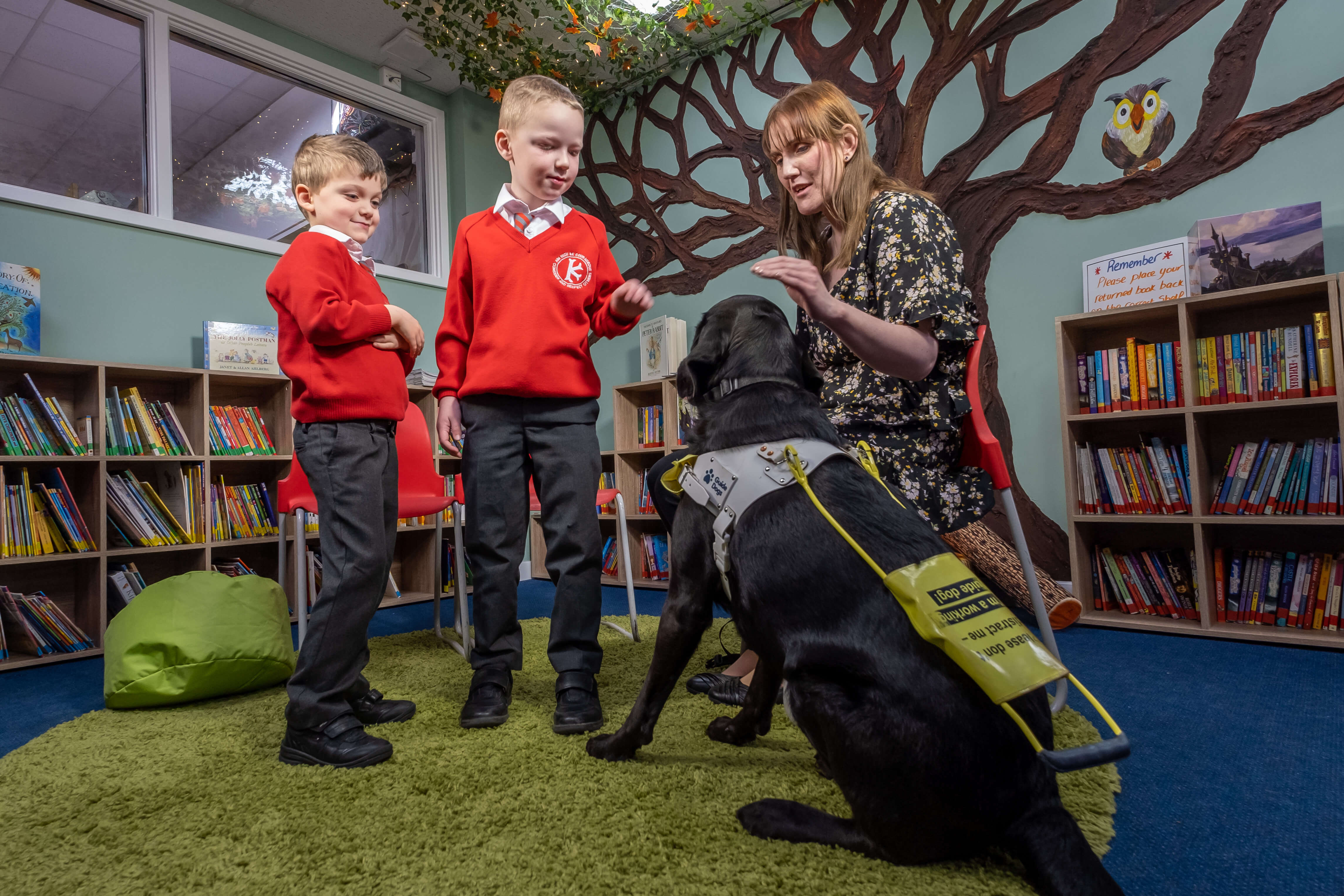 Siobhan Meade with her guide dog Marty visit with children at Kingston Primary School in Benfleet Essex.