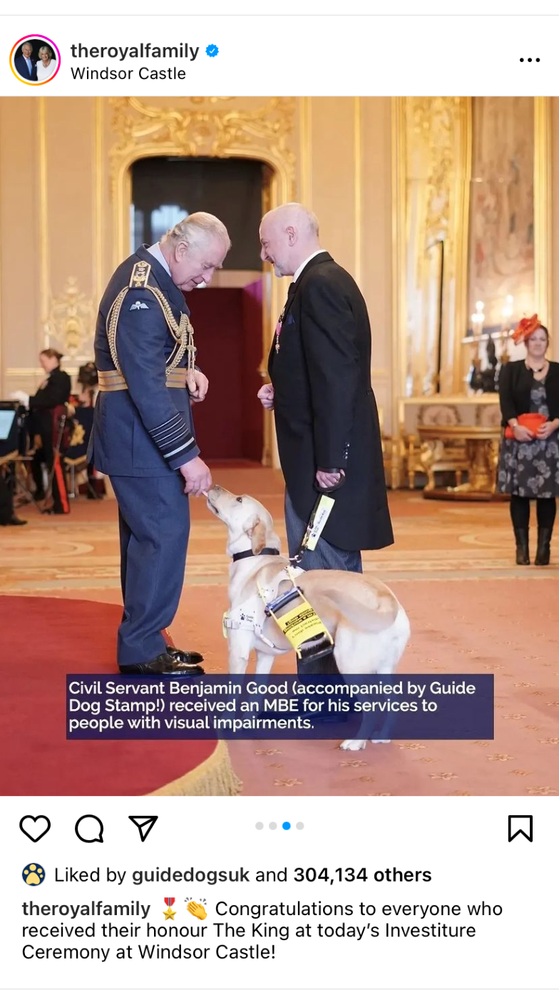 A post from the Royal Family's Instagram account, showing Ben Good receiving his MBE from King Charles at Windsor Castle while Guide Dog Stamp licks the King's hand. The photo is accompanied by a caption congratulating everyone who received an honor at the ceremony.