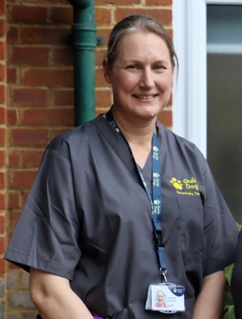 Headshot of Caroline Goulton, Veterinary Surgeon at Guide Dogs, wearing blue scrubs.