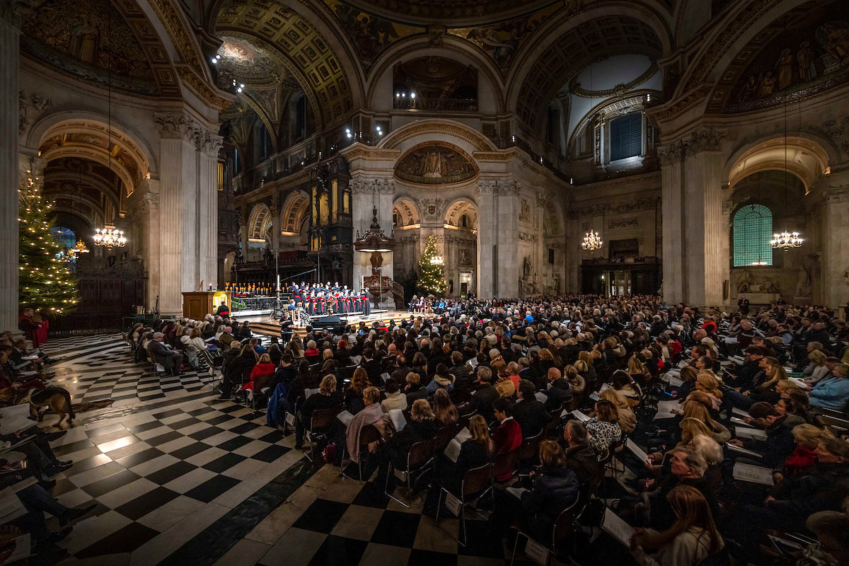A view of the Guide Dogs congregation inside St Paul's Cathedral, with St Paul's Choir performing onstage.