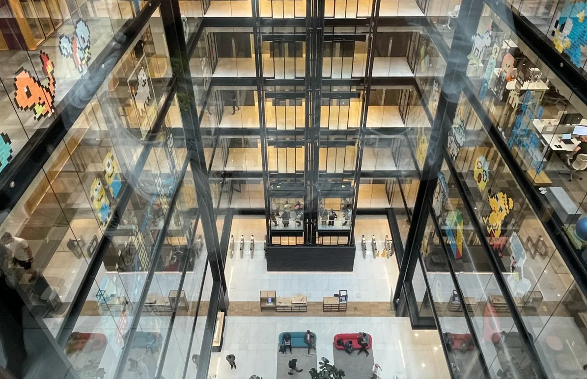 Looking down into the atrium of Google's Accessibility Discover Centre from the top floor. 