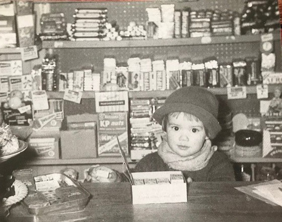 Sophie Thompson as a child in a shop