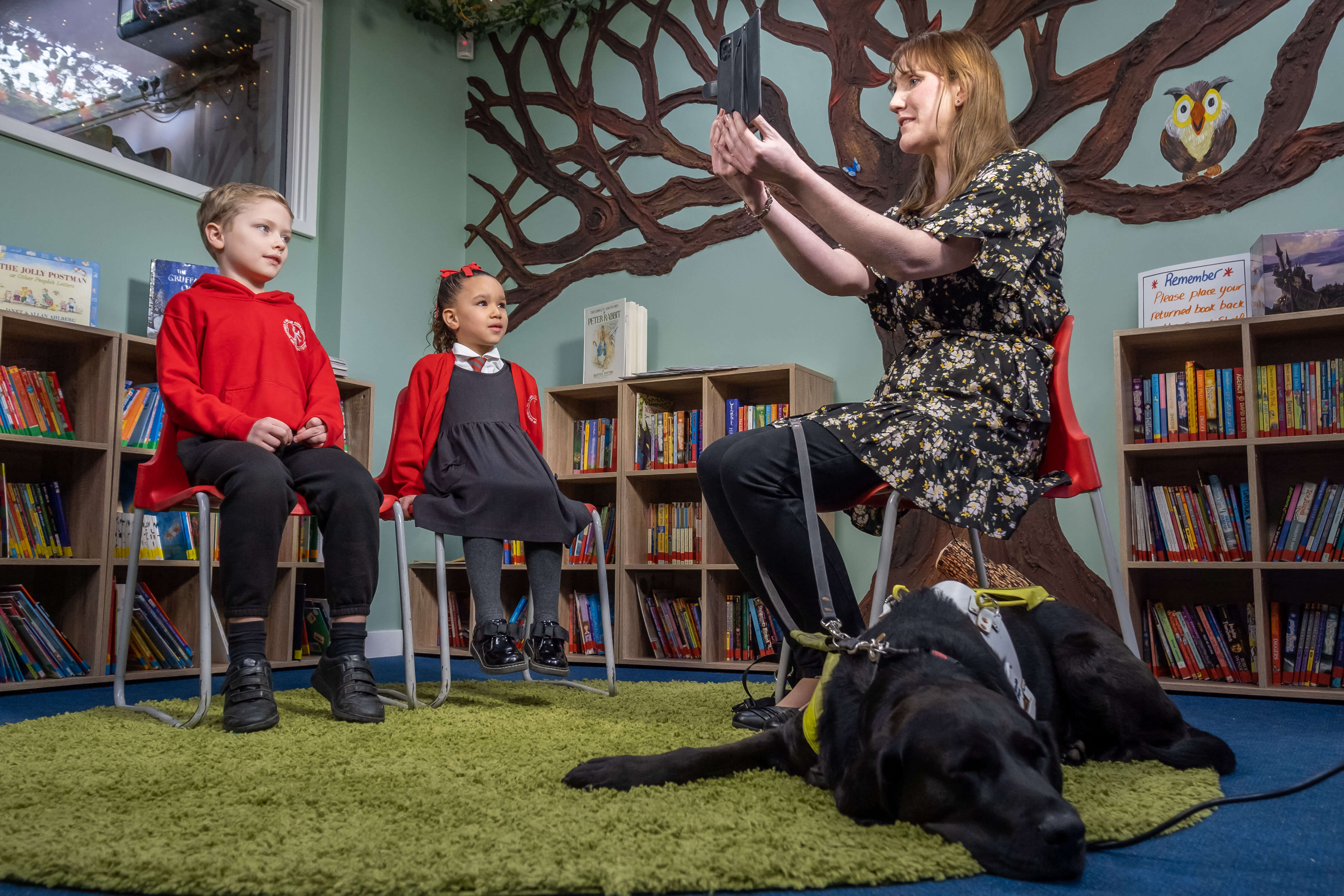 Siobhan Meade with her guide dog Marty visit with children at Kingston Primary School in Benfleet Essex.
