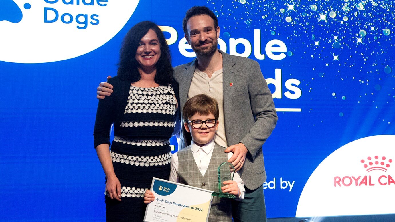 Rex Davies receives his Overall Service User Winner award from actor Charlie Cox and Deborah Bourne, Director of Fundraising 