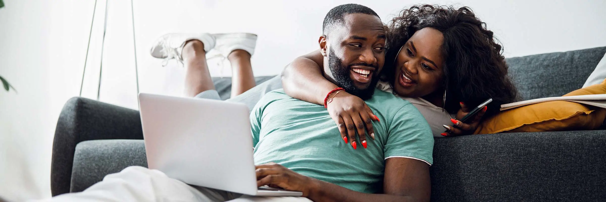  A couple looks over their investment accounts at home on a laptop