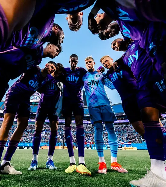 CLTFC players huddle together before a match. 