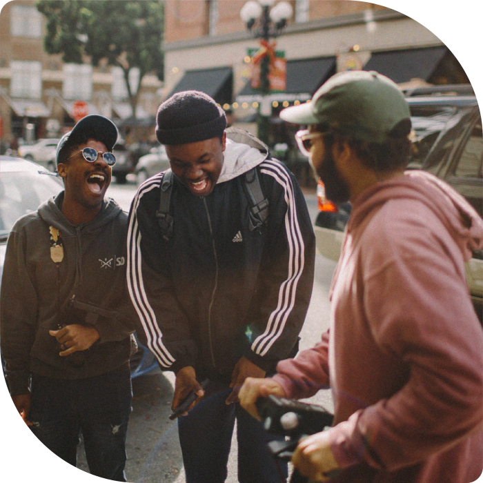 Three young black guys joking and laughing