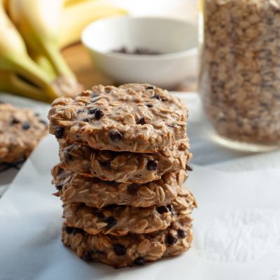 oatmeal cookies stacked on parchment paper 