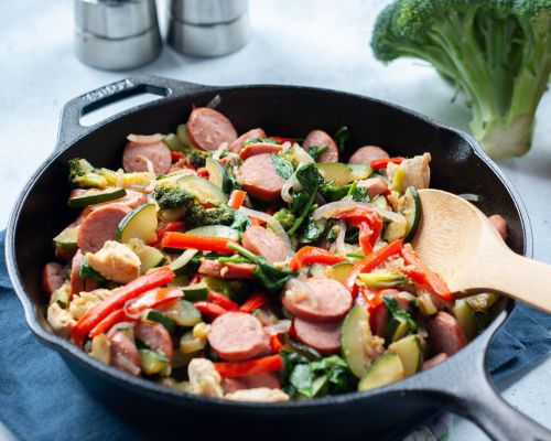 sausage and vegetables in a skillet 