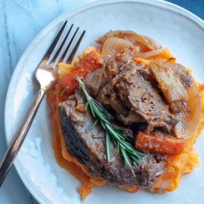 pot roast plated with mashed sweet potatoes 