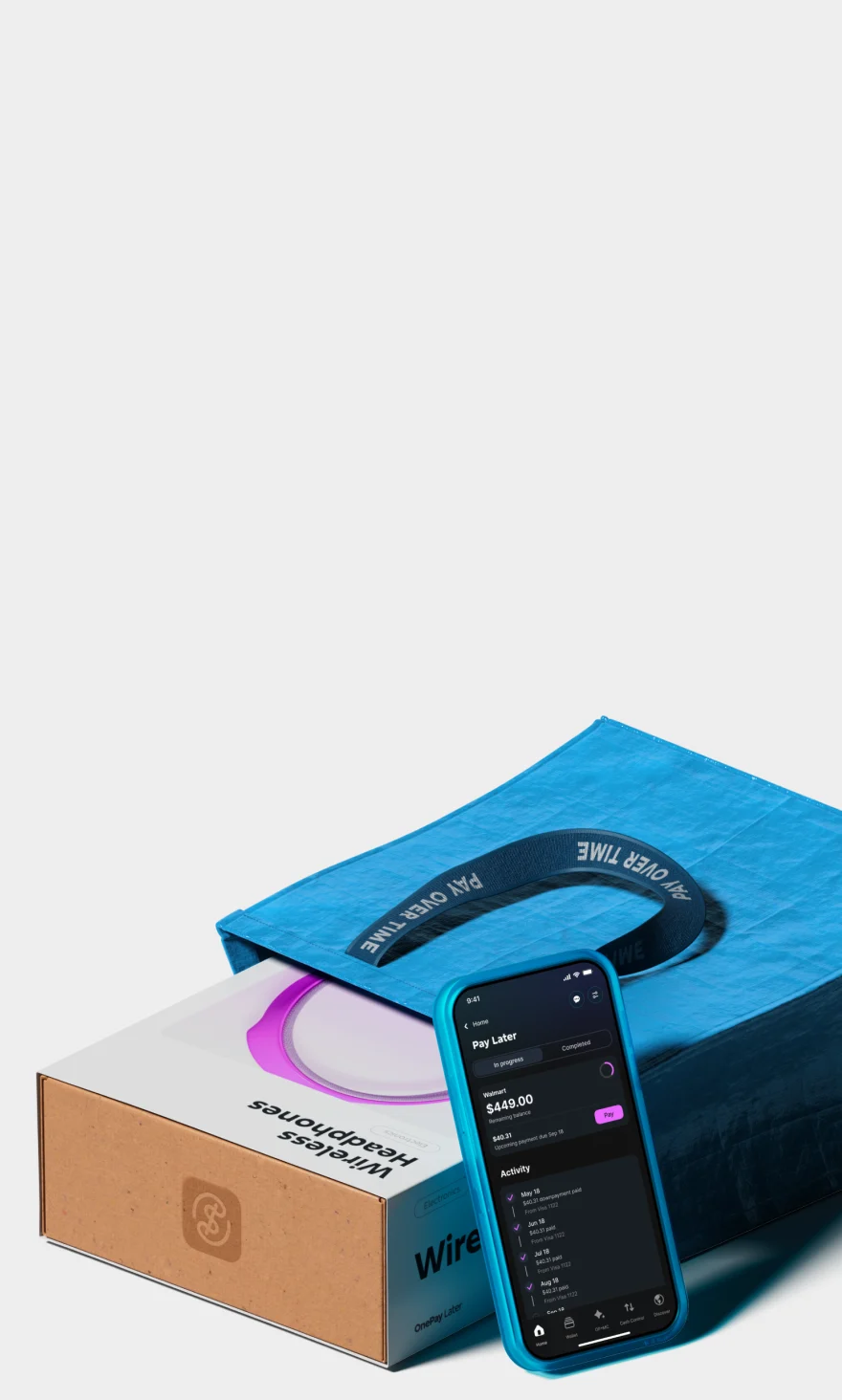 Blue shopping bag on a white surface with a wireless headphone box peeking out. Blue iPhone with Pay Later plan screen.