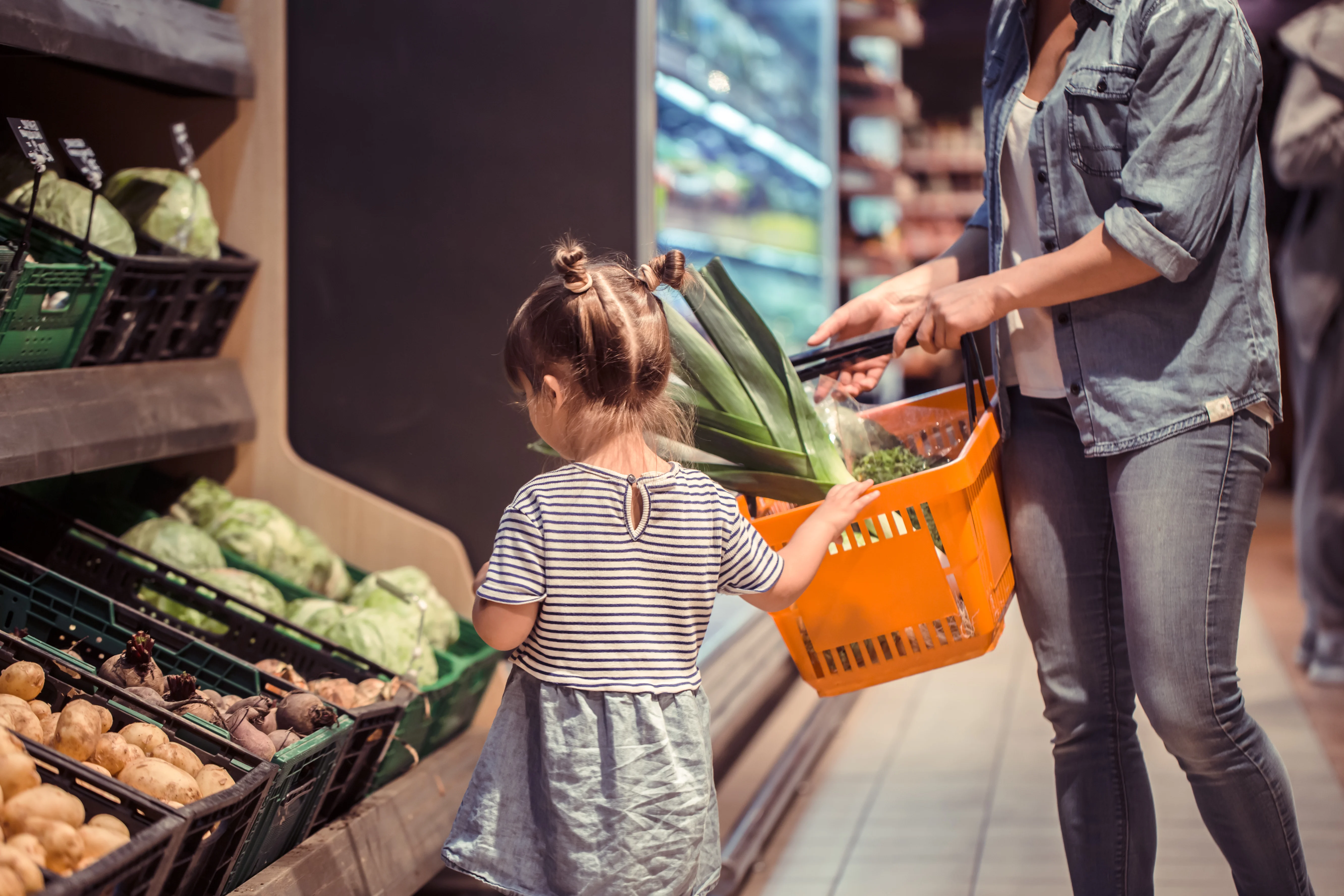 mother with small child shopping in the grocery store