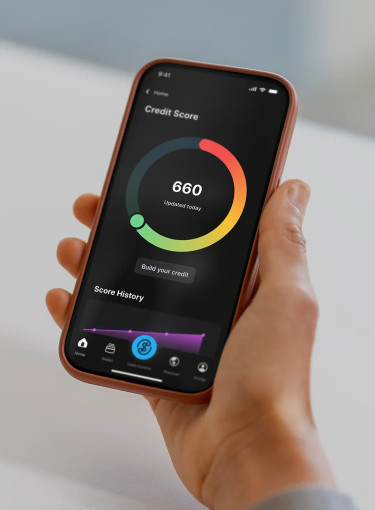 A customer holding a phone showing the credit score wheel in the OnePay app.