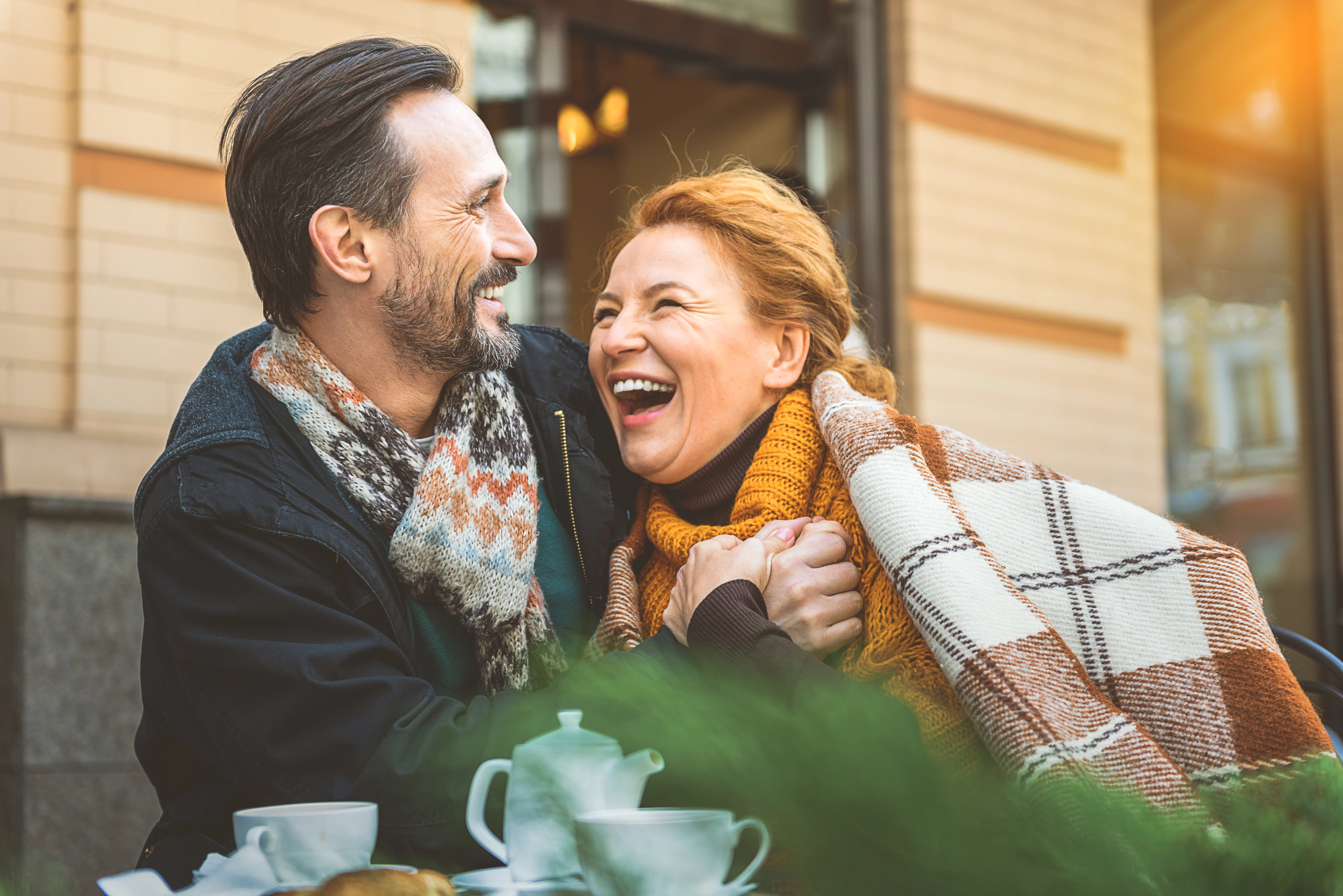 smiling middle-aged couple hugging