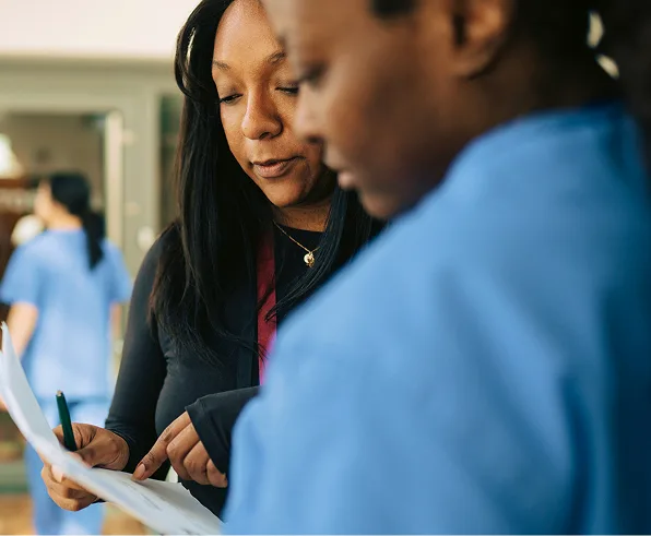 header-two-woman-healthcare-providers-t