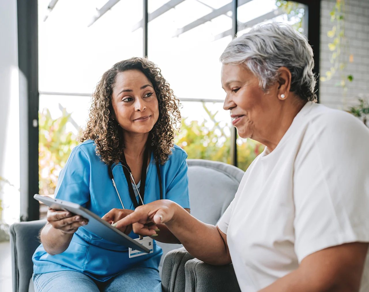 media-female-doctor-helping-female-patient-d