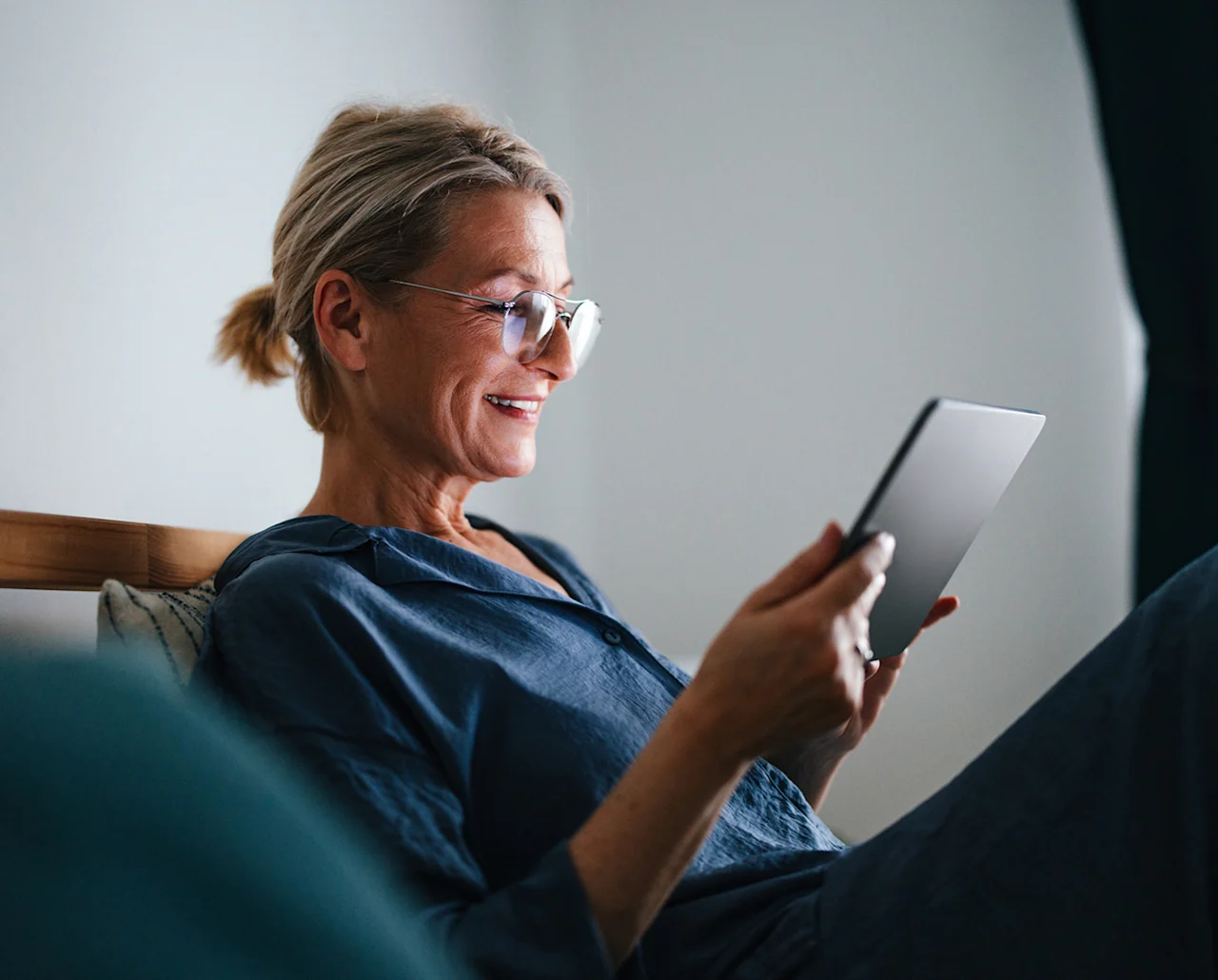 media-woman-smiling-looking-at-device