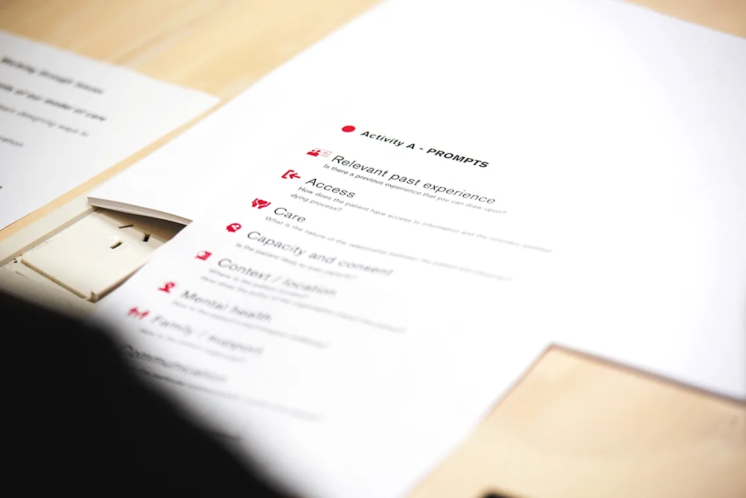 A workshop activity sheet on a table in front of a person.