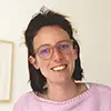A photo of Nicole smiling.