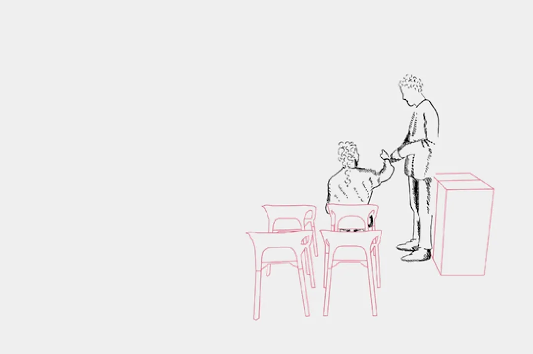 Man seated. man standing beside seated man holding hand