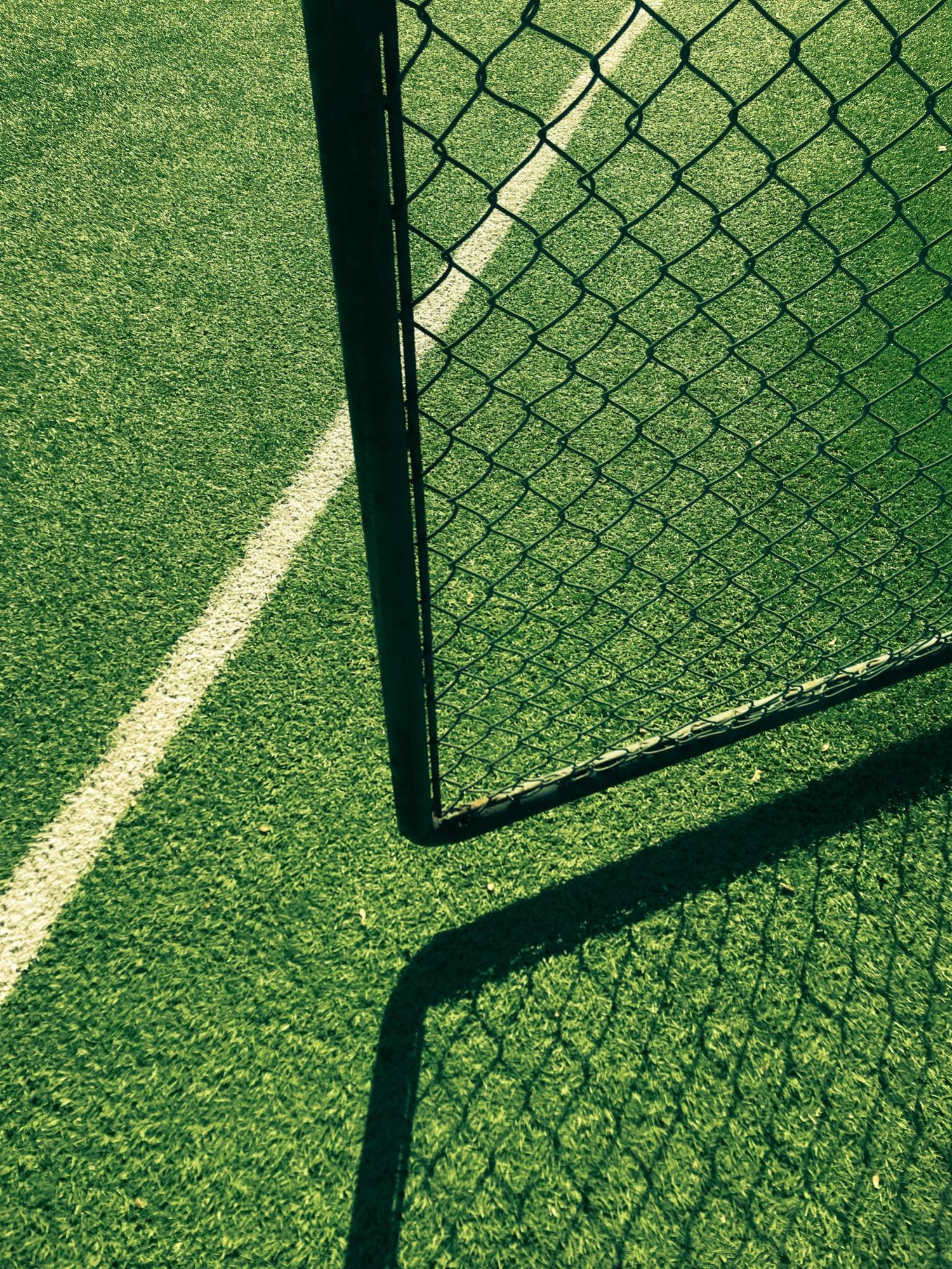 Community sports field with goal and fence