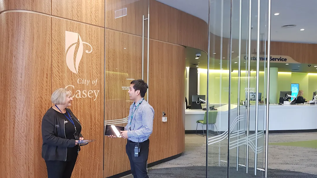 Two conceirges working in Bunjil Place, the main council building in the City of Casey.